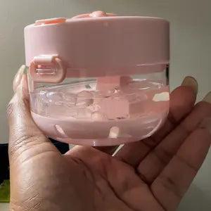 Pink cleaner case with a clear lower chamber