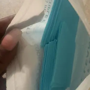 Open floor-cleaning tablet package showing the blue tablets inside