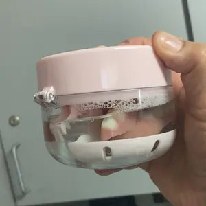 Dental appliance soaking inside the pink cleaner case